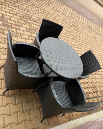 Outdoor rattan dining set in black